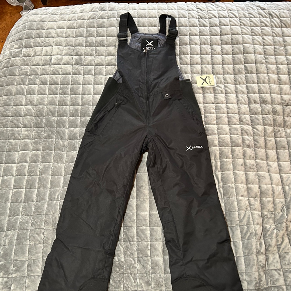 Arctix Black Winter Bib Overalls with Durable Material
A2